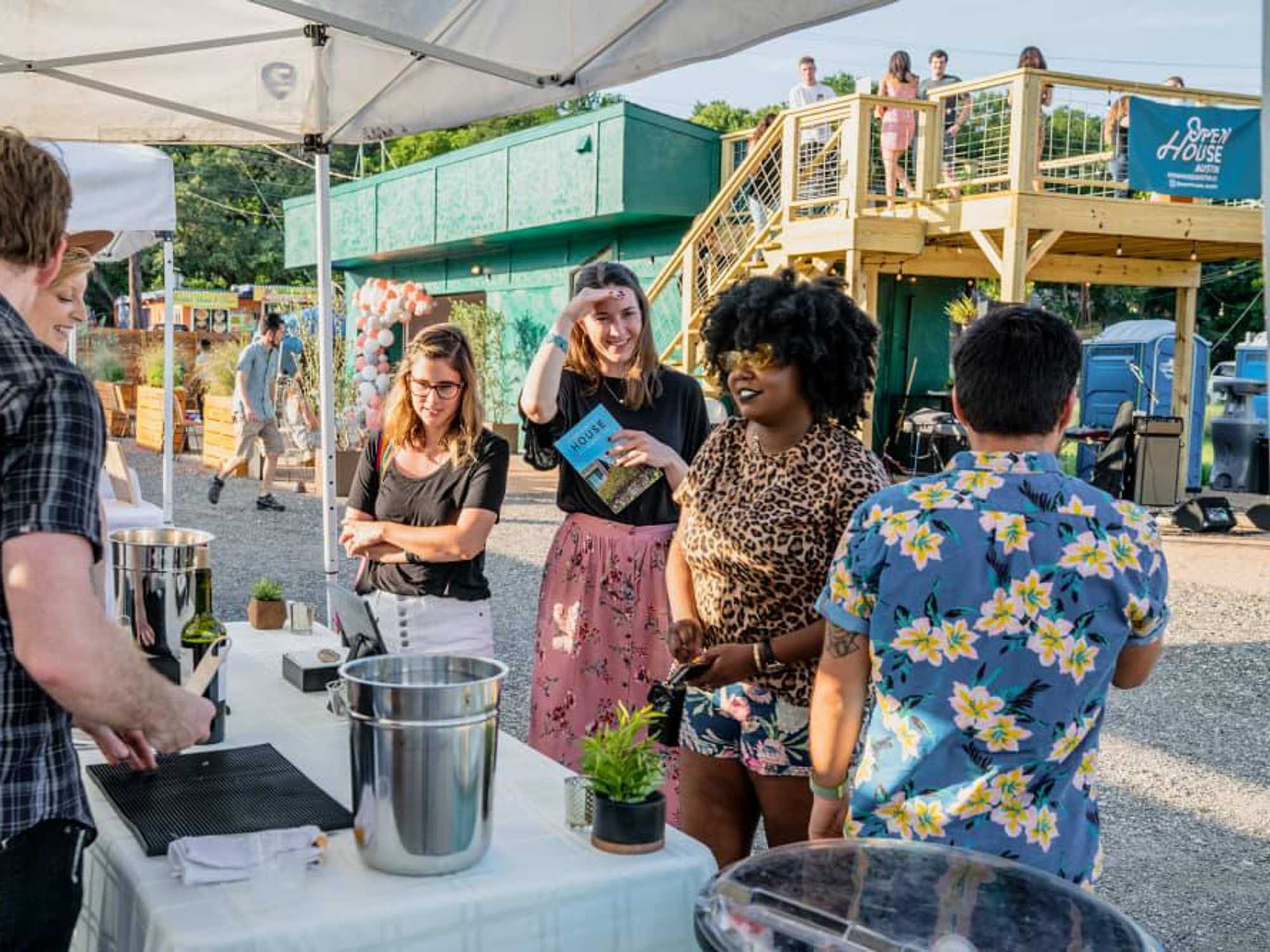 People gathering at Open House Austin’s outdoor community space